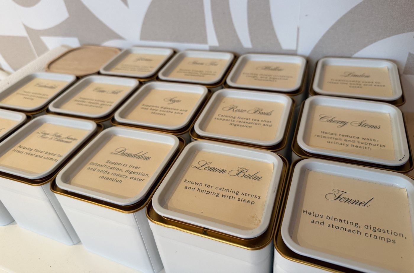 Seena tea collection in white and gold tins labelled with each herb